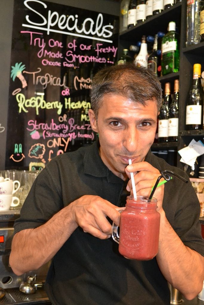 Majid Pour sipping on a Raspberry Heaven smoothie at Caffe Bambino