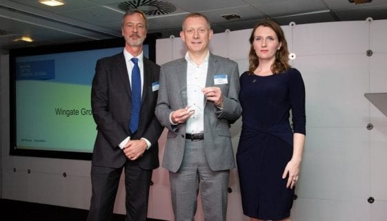 Ben Clarke (centre), managing director of Wingate Group, picking up their FT Adviser award