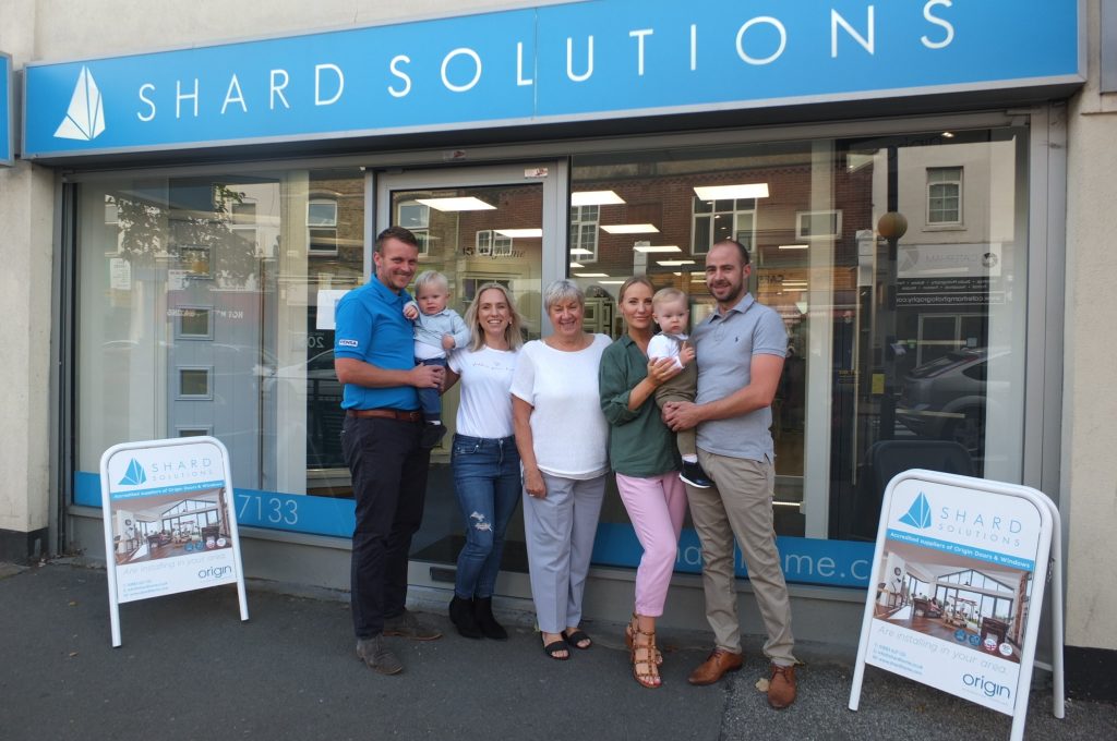 The Shard Solutions family outside their Caterham showroom